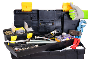 Wall Mural - Plumber or carpenter tool box isolated. Black plastic tool kit box with assorted tools and with various nails, screws, fasteners as well as dowels isolated on a white background.