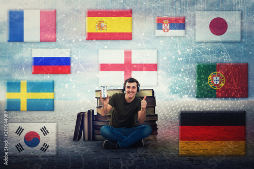 Leinwand Poster student guy learn different languages on headphones