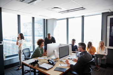 Creative business team working together in a busy casual office