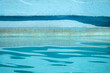 © sshoults - Edge of blue swimming pool with rippled water