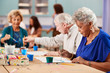 © Monkey Business - Group Of Retired Seniors Attending Art Class In Community Centre With Teacher