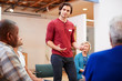 © Monkey Business - Man Standing To Address Self Help Therapy Group Meeting In Community Center