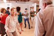 © Monkey Business - People Attending Dance Class In Community Center
