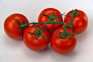 Five red ripe tomatoes