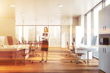 Wall Mural - Blonde businesswoman in open space office