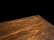 © Merih Unal Ozmen - Perspective view of wood or wooden table corner isolated on black background including clipping path