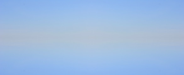 Blue sky gradient background with small clouds texture. Blank backdrop of pale light blue tone, sky banner with copy space