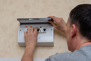 Man fixing Electrical board at the home