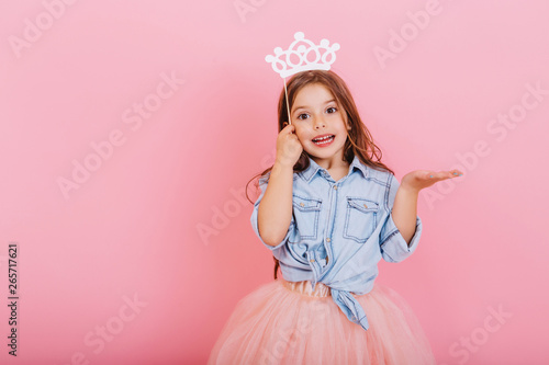 Joyful Little Girl With Long Brunette Hair In Tulle Skirt Holding