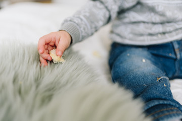 Little toddler boy's hand with a snack