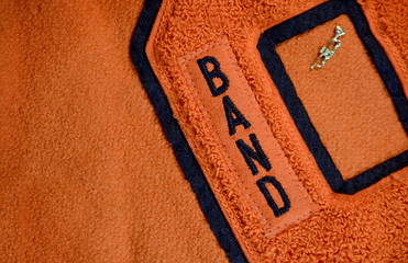band award patch sewn on high school letter jacket with trumpet pin