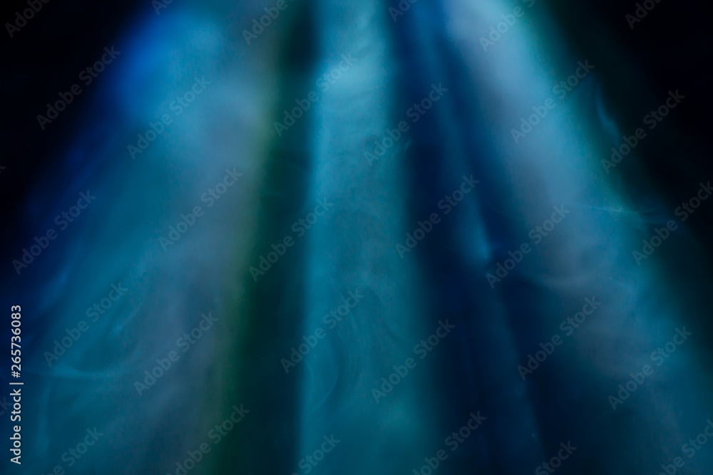 projector spotlight blue color , smoke texture background . light beam ...