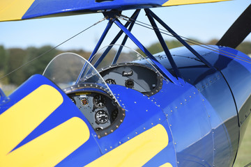 Wall Mural - Cockpit area of a colourful aerobatic biplane.