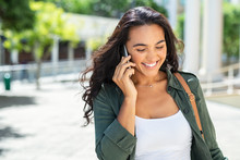 Latin Smiling Woman Talking On Phone