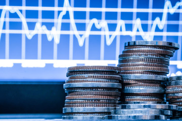 Double exposure of graph and rows of coins for finance and business concept., ECN digital economy and economic exchange.