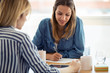 © nenetus - Two pretty young businesswoman working of new ideas in the office.