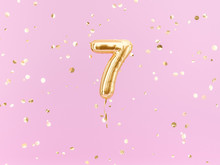 Seven Year Birthday. Number 7 Flying Foil Balloon On Pink. Seven-year Anniversary Gold Confetti Background. 3d Rendering