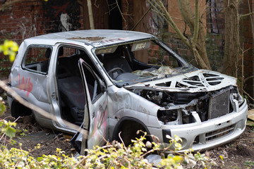 destroyed abandoned car graffiti