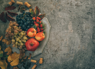 Wall Mural - Fresh fruits. Assorted autumn fruits colorful vintage background. Flat lay with copy space. Toned image.