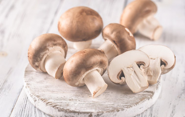 Canvas Print - Champignon mushrooms on the wooden board