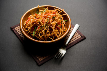 Canvas Print - Chinese Bhel is a spicy indo-chinese recipe, served in a bowl. selective focus