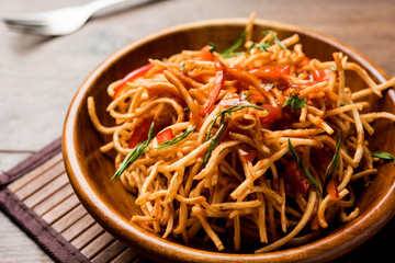 Canvas Print - Chinese Bhel is a spicy indo-chinese recipe, served in a bowl. selective focus