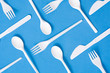 Disposable plastic tableware pattern on blue background