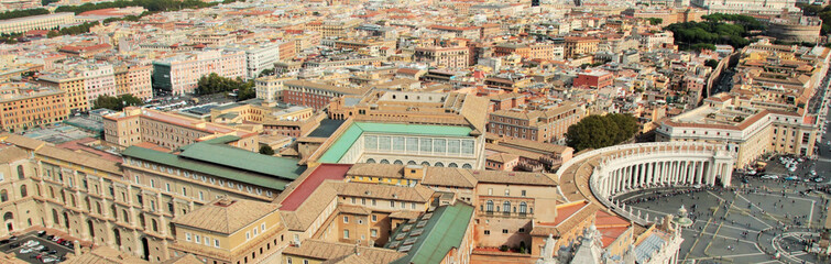 Panoramic view of the main square of the Vatican and the historical center of Rome, high contrast, bright colors, colored roofs of houses, a sunny day.