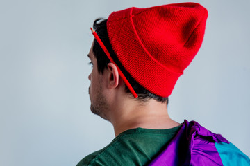 Wall Mural - Style man in red hat and trendy clothes with pencil on ear.