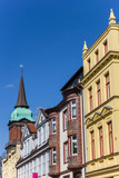 Fototapeta Miasto - Colorful houses and church tower in Schwerin, Germany