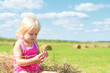 © jordano - Small Rural Girl On Straw After Harvest