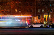 Lightstreaks from a New York City firetruck or ambulance speeding down an empty Harlem street late at night