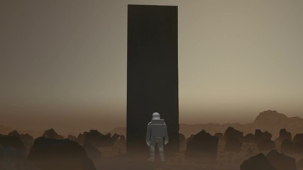 Wall Mural - astronaut walking on the surface of a mars like planet stops and a monolith constructs itself in fro