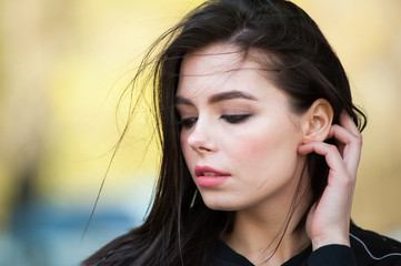 Beautiful smiling young woman wearing black jacket