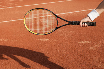 Wall Mural - A tennis player prepares to serve a tennis ball during a match