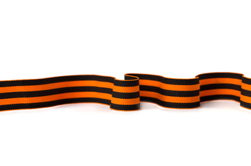 St. George ribbon on a white background. Black orange ribbon close up on a white background.