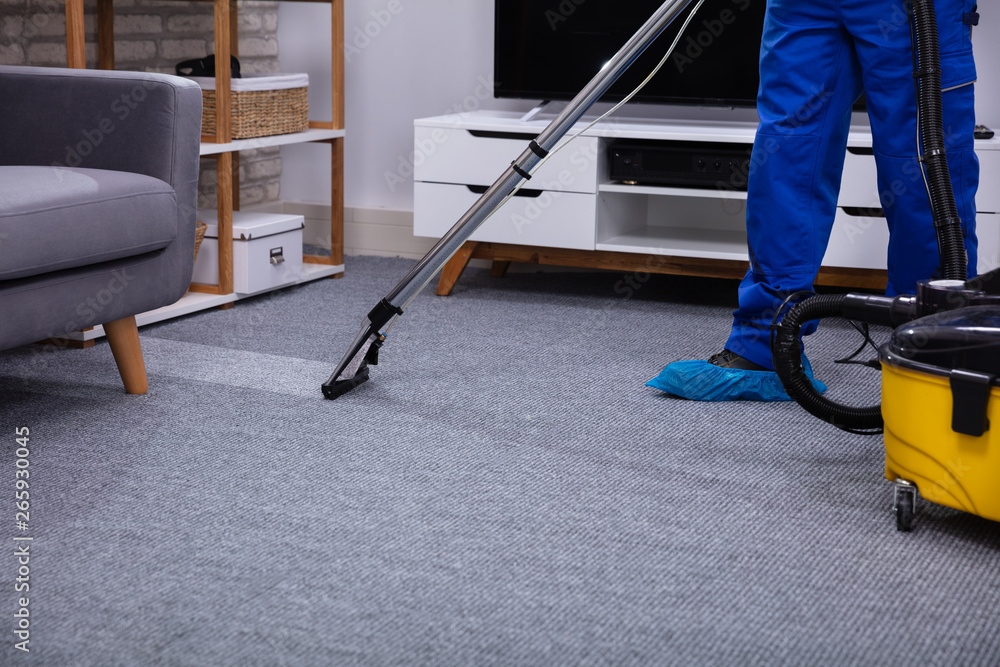 Male Janitor Cleaning Carpet - obrazy, fototapety, plakaty 