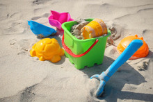 Colored Toys On The Sandy Beach