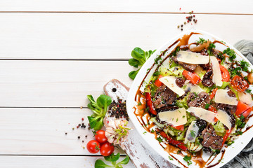 Vegetable salad with beef and parmesan cheese. Top view. free copying space.