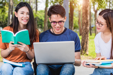 Wall Mural - Male students are opening computers to discuss