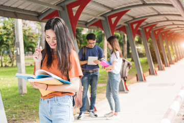 Wall Mural - Young woman girl, student hold note book at college