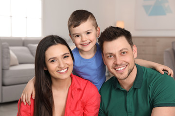 Poster - Happy parents and their son at home. Family portrait