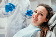 © HBS - Smiling young woman receiving dental checkup. close up view. Healthcare and medicine concept.