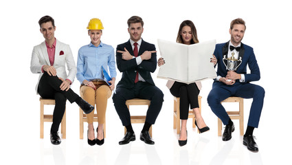 Canvas Print - group of young different people waiting for a job interview