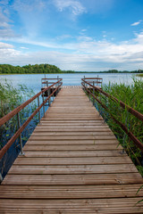 wooden plank foothpath boardwalk trampoline in the lake