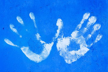 White hand print on blue background