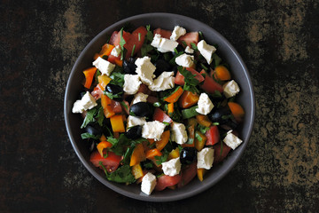 Wall Mural - Arabic salad with vegetables, olives and feta.