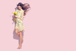 © Subbotina Anna - Beauty glamour girl with spring tulip flowers. Beautiful young woman posing with bouquet of tulips. Happy model wearing chiffon dress, full length portrait