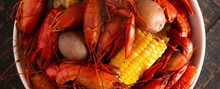 A Crawfish Boil With Corn On The Cob And Potatoes