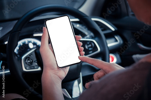 hand man holding use smartphone new model, For searching for directions, travel, in the latest car models.Concept of using a car phone For convenience and reduce accidents.blank screen